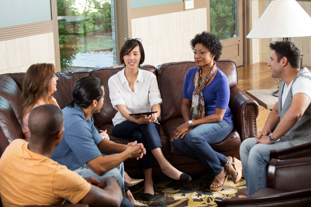 group of people participating in discrimination mediation and de-escalation techniques